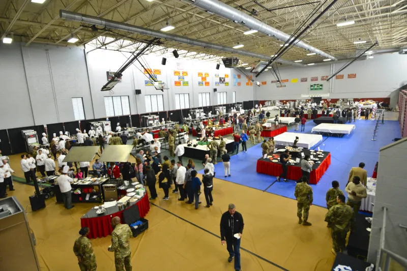 Attendees eagerly anticipate their meals at the 42nd Annual Military Culinary Arts Competitive Training Event 