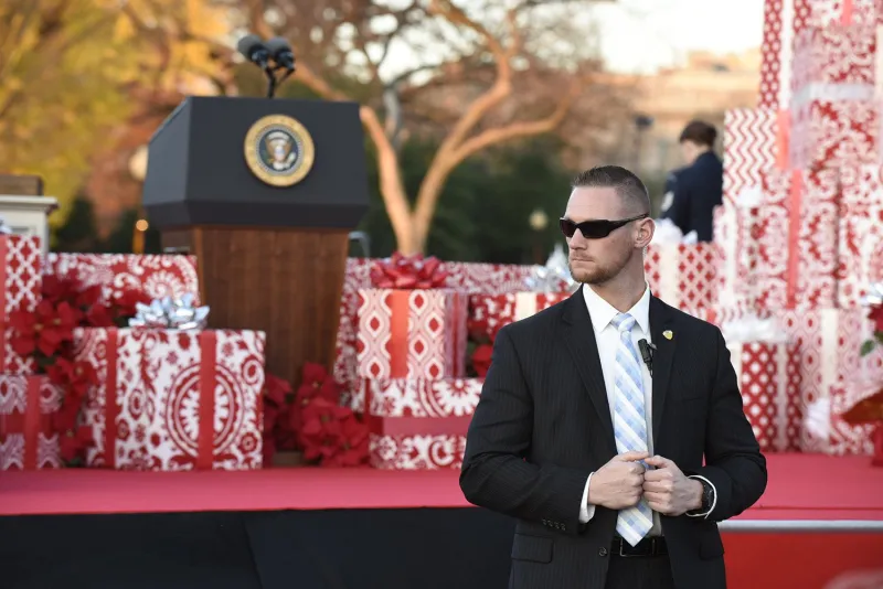 Safeguarding the holiday season. A U.S. Secret Service agent protects President Obama and the First Family during the National Christmas Tree lighting at President’s Park in Washington, D.C.