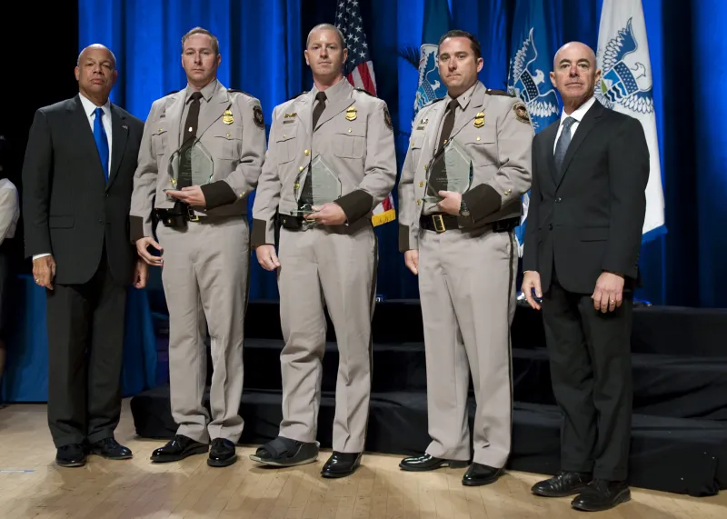 Secretary of Homeland Security Jeh Johnson and Deputy Secretary of Homeland Security Alejandro Mayorkas presented the Secretary's Award for Valor to U.S. Customs and Border Protection San Diego Marine Unit officers Christopher Hunter, Craig Jenkins, and Arian Linscott.