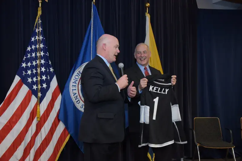 Director Clancy presents Secretary Kelly with a U.S. Secret Service hockey team jersey