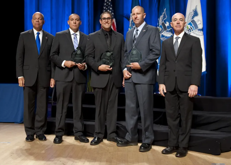 Secretary of Homeland Security Jeh Johnson and Deputy Secretary of Homeland Security Alejandro Mayorkas presented the Secretary's Award for Valor to members of U.S. Immigration and Customs Enforcement Homeland Security Investigations Agents Tad A. Freesmeier, Manuel Dorado, and Nicholas Koahou.