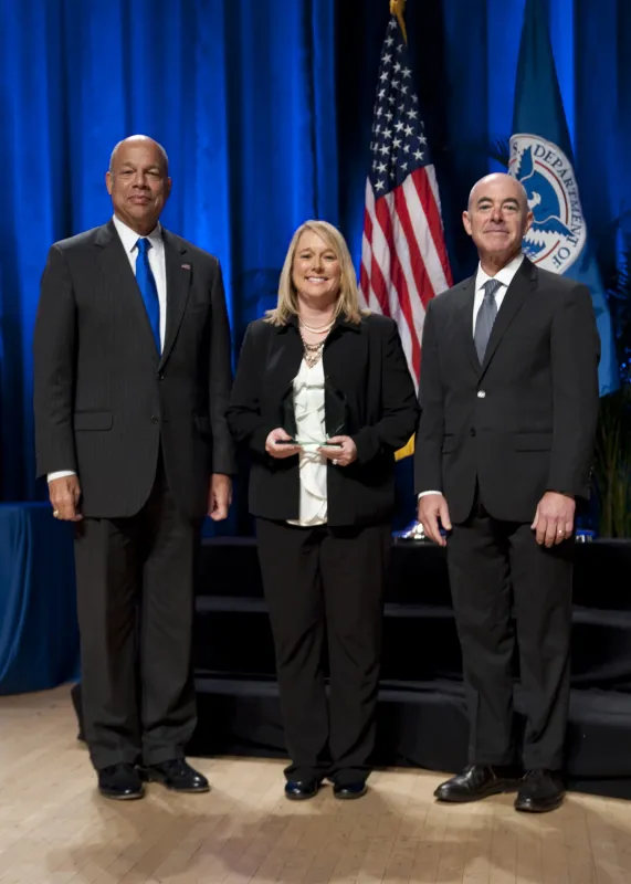 Secretary of Homeland Security Jeh Johnson and Deputy Secretary of Homeland Security Alejandro Mayorkas presented the Secretary's Unit Award to Kim Cochenour on behalf of the U.S. Customs and Border Protection Electronic Collection Team Dean Baker, Abigail Hake, Morgan Jones, Emily Morris, and William Smith.