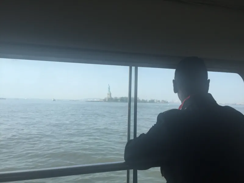 Secretary Johnson travels by boat to Ellis Island