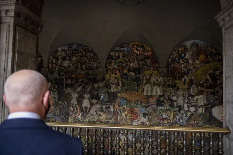 Secretary Mayorkas looks at Diego Rivera’s mural at Mexico’s Palacio Nacional