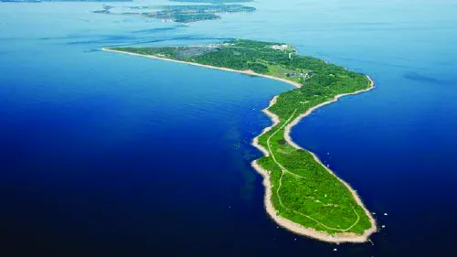 Plum Island aerial view from above surrounded by body of water.