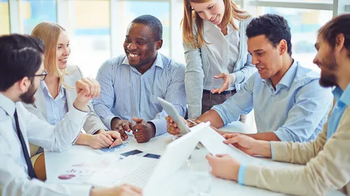 6 people meeting around a table