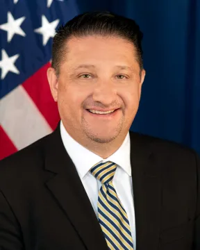 Headshot of John F. Tobon, Acting Assistant Director, Countering Transnational Organized Crime.