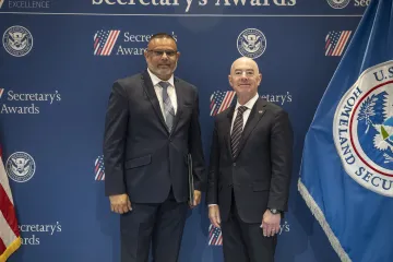 Innovation Award recipient Richard R. Lall (left) with DHS Secretary Alejandro Mayorkas (right).