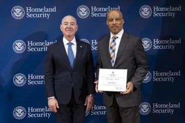 DHS Secretary Alejandro Mayorkas with Innovation Award recipient, Jeffrey Wilson.