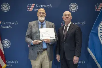 Innovation Award recipient, Michael J. Bostic (left) with DHS Secretary Alejandro Mayorkas (right).