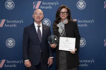 DHS Secretary Alejandro Mayorkas (left) with Innovation Award recipient Marta Sisco-Izak (right).