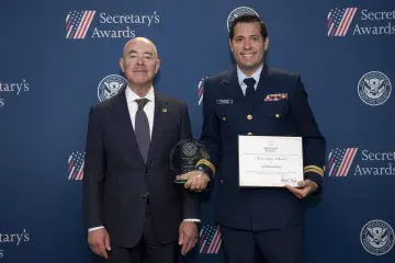 DHS Secretary Alejandro Mayorkas (left) with Innovation Award recipient Cliff Rosenberg (right).