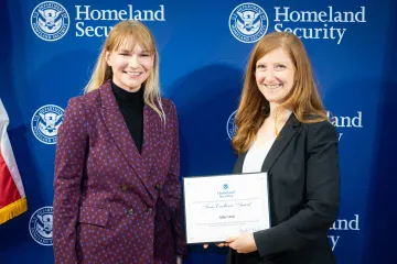 Acting DHS Deputy Secretary Kristie Canegallo with Team Excellence Award recipient, Abby Deift.