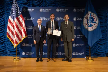 DHS Secretary Alejandro Mayorkas (left), Secretary's Gold Medal recipient Lucian Sikorskyj (center), and Deputy Under Secretary for Management, Randolph Alles (right).