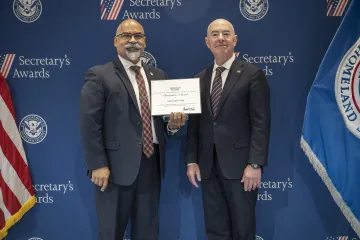 Innovation Award recipient Juan Lopez Vega with DHS Secretary Alejandro Mayorkas.