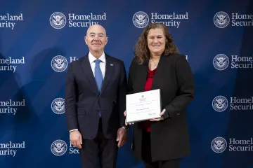 DHS Secretary Alejandro Mayorkas with Innovation Award recipient, Maryellen Meymarian.