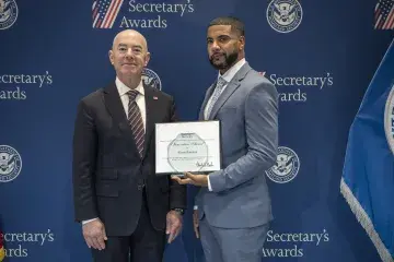 Innovation Award recipient Alexis Ramirez (left) with DHS Secretary Alejandro Mayorkas (right).