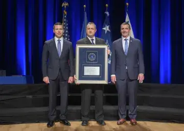 Caption: <p>WASHINGTON (Nov. 6, 2019) Acting Homeland Security Secretary Kevin McAleenan and Acting Deputy DHS Secretary David Pekoski present the Unit Award to the Mt. Weather IT Services Team at the 2019 Secretary’s Award Ceremony at the Daughters of the American Revolution Constitution Hall. (DHS Photo by Tim D. Godbee/Released)</p>