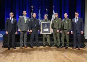 Caption: <p>WASHINGTON (Nov. 6, 2019) Acting Homeland Security Secretary Kevin McAleenan and Acting Deputy DHS Secretary David Pekoski present the Unit Award to the Law Enforcement Safety and Compliance Directorate 9mm Contract at the 2019 Secretary’s Award Ceremony at the Daughters of the American Revolution Constitution Hall. (DHS Photo by Tim D. Godbee/Released)</p>