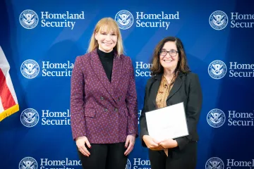 Acting DHS Deputy Secretary Kristie Canegallo with Team Excellence Award recipient, Jennifer Ellison.