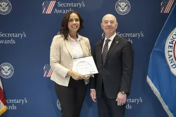 Innovation Award recipient Saby I. Santiago (left) with DHS Secretary Alejandro Mayorkas (right).