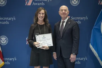 Champion of Equity Award recipient Elizabeth Clark (left) with DHS Secretary Alejandro Mayorkas (right).