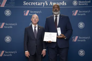 DHS Secretary Alejandro Mayorkas (left) with Champion of Equity Award recipient Kevin Tillman (right). 