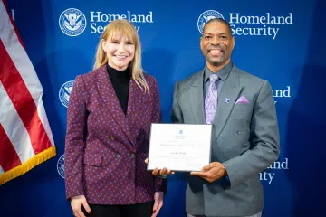 Acting DHS Deputy Secretary Kristie Canegallo with Champion of Equity Award recipient, Gordon Walker.