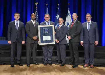 Caption: <p>WASHINGTON (Nov. 6, 2019) Acting Homeland Security Secretary Kevin McAleenan and Acting Deputy DHS Secretary David Pekoski present the Unit Award to the TSA Mission Training Unit at the 2019 Secretary’s Award Ceremony at the Daughters of the American Revolution Constitution Hall. (DHS Photo by Tim D. Godbee/Released)</p>