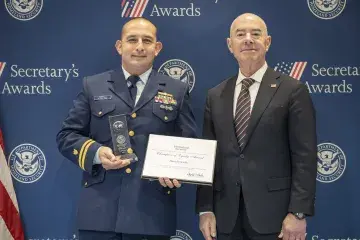 Champion of Equity Award recipient David Castillo (left) with DHS Secretary Alejandro Mayorkas (right).