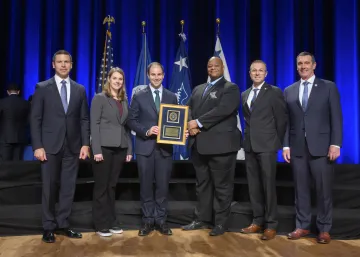 Caption: <p>WASHINGTON (Nov. 6, 2019) Acting Homeland Security Secretary Kevin McAleenan and Acting Deputy DHS Secretary David Pekoski present the Leadership Excellence Award to the CISA Vulnerability Management and Coordination Team at the 2019 Secretary’s Award Ceremony at the Daughters of the American Revolution Constitution Hall. (DHS Photo by Tim D. Godbee/Released)</p>