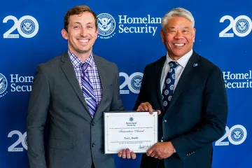 Innovation Award recipient, Trey Rozelle, with DHS Deputy Secretary John Tien.
