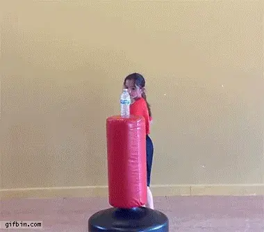Animated image of a little girl kicking a bottle of water in the air.  Courtesy of http://gifbin.com