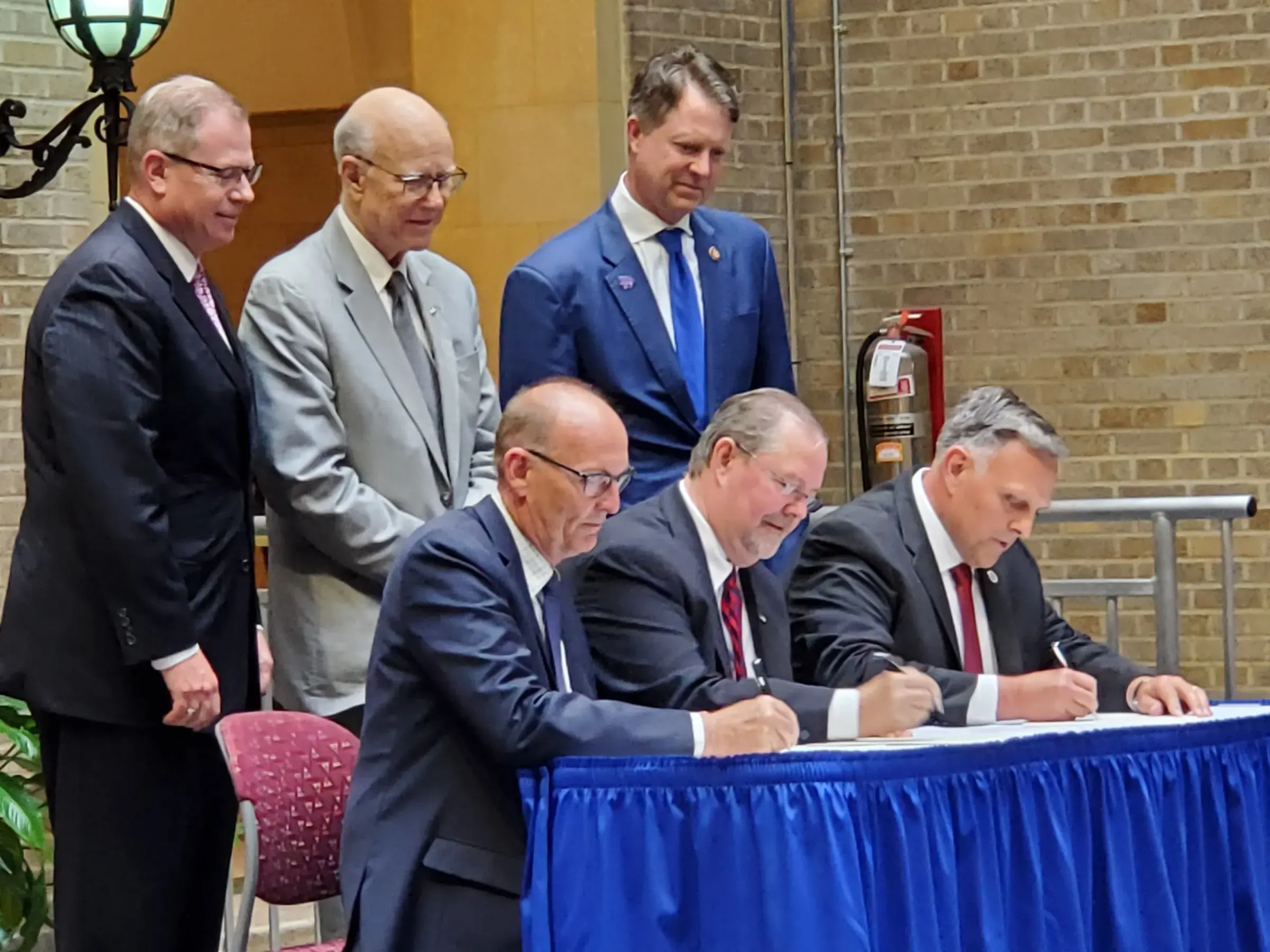 The agreement was signed by USDA Under Secretary for Marketing and Regulatory Programs Greg Ibach, USDA Deputy Under  Secretary for Research, Education, and Economics Scott Hutchins, and DHS Senior Official Performing the Duties of the Under Secretary for Science and Technology William Bryan