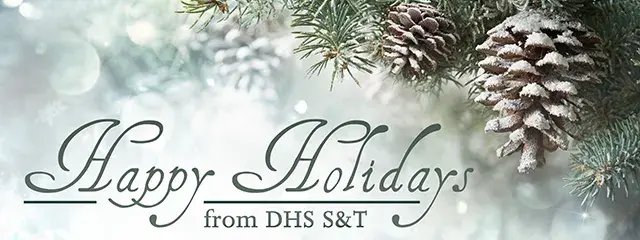 Winter scene with snowy pinecones. Happy Holidays from DHS S&T.