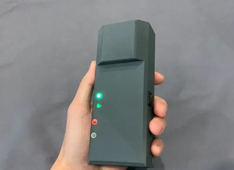 Prototype POINTER receiver, which is worn by responders entering a structure. What is now the size of a cell phone will ultimately be reduced in scale and potentially integrated into existing firefighting equipment.
