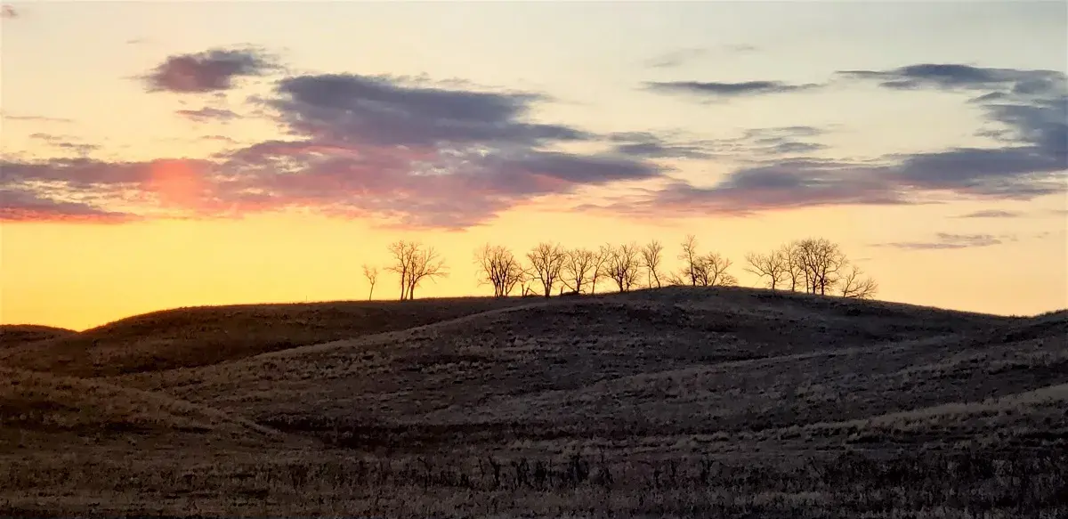 The sun rising over the prairies and rolling hills that surround Camp Grafton, North Dakota.