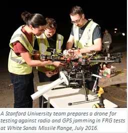 A Stanford University team prepares a drone for testing against radio and GPS jamming in FRG tests at White Sands Missile Range, July 2016.