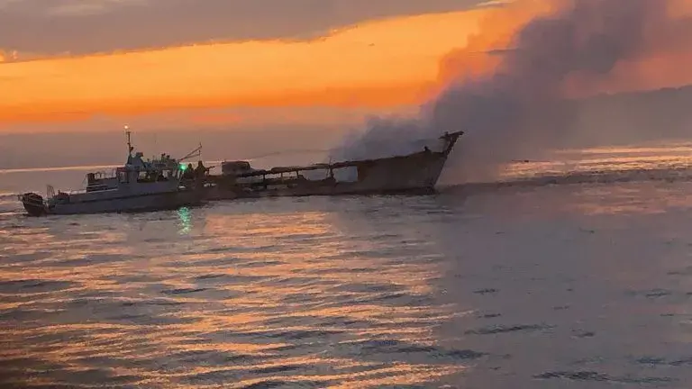 At dawn on September 3, smoke from the Conception Boat continues to drift as the fire is being extinguished. Photo courtesy of Ventura County Fire Protection District.