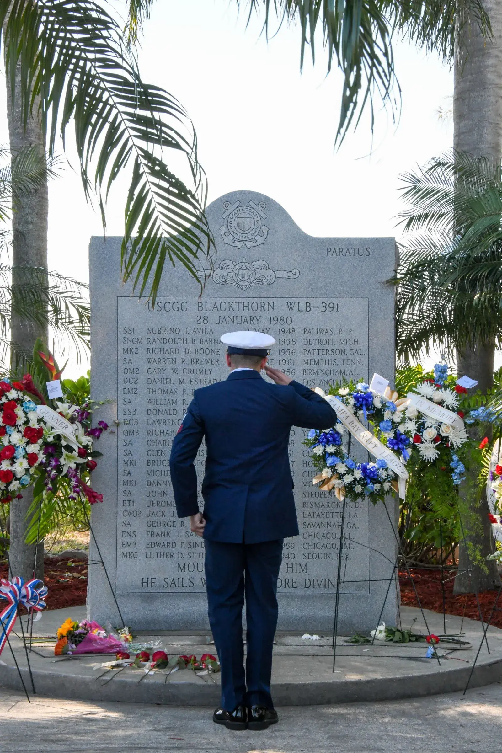 Coast Guard Member In Front of Monument 