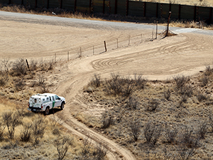 A photograph of a CBP vehicle in the desert.
