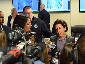 A photograph of Governor Gina Raimondo being interviewed by media during Winter Storm Jonas.