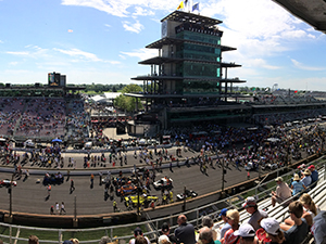 A photograph of spectators overlooking the Indy 500 race track.