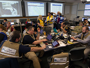 A photograph of HSIN representatives supporting fusion center operations during the Super Bowl.