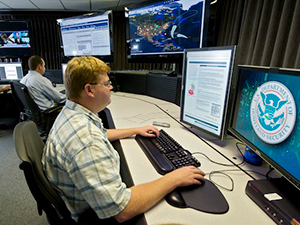 A photo of a man using a computer